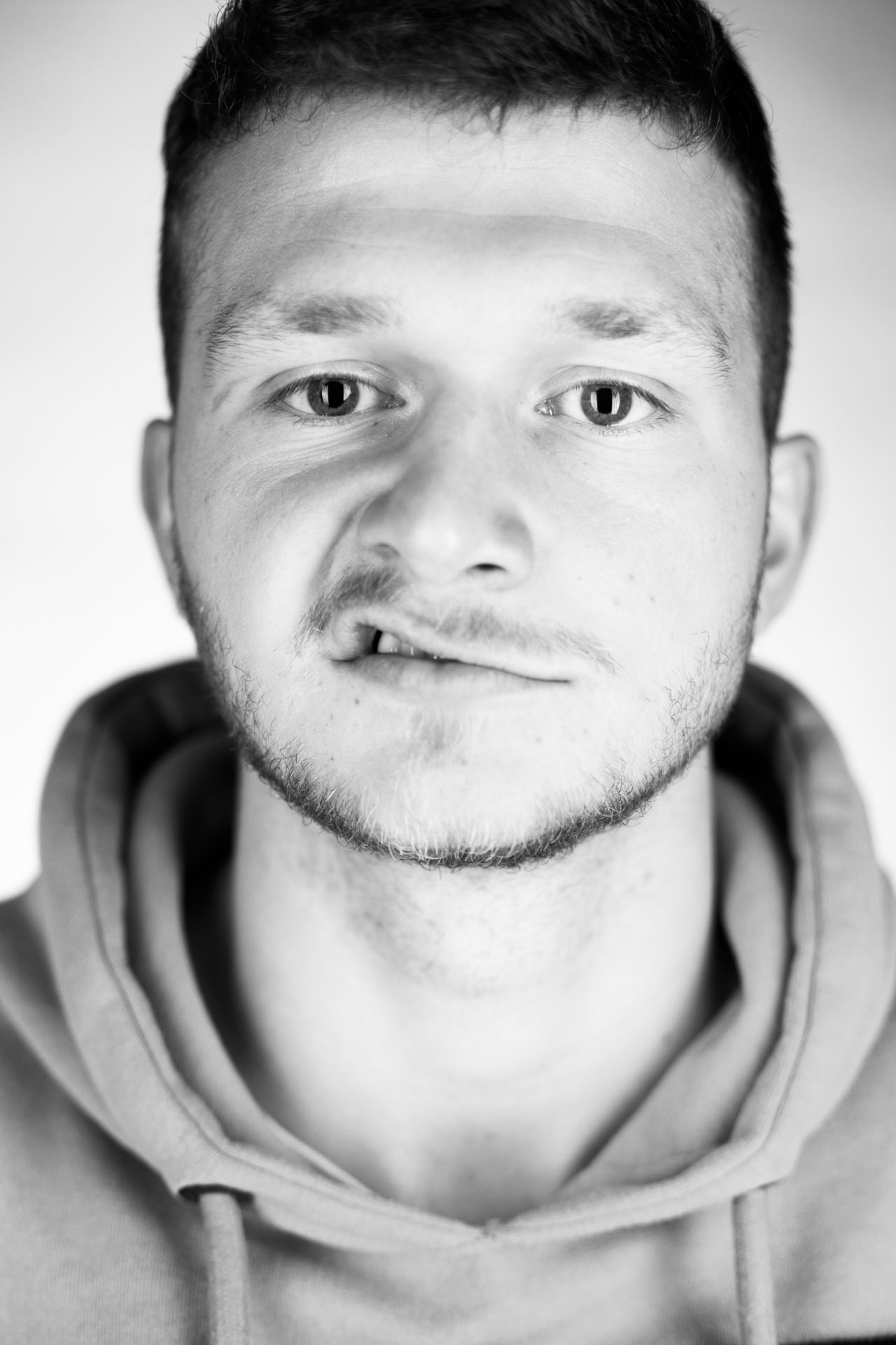 Portrait of Jonas lifting the corner of his upper lip
